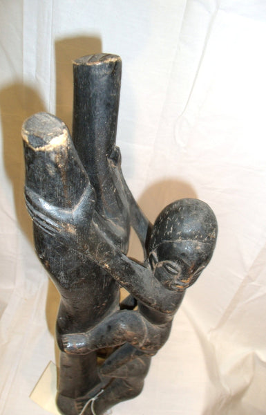 Statue Of A Boy Climbing Tree Ghana